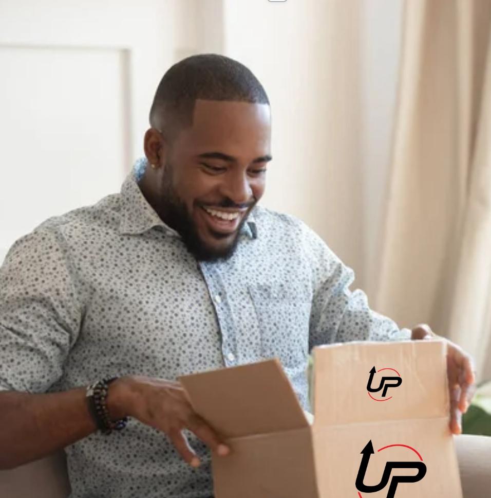 A man opening a box that has the logo for Up Proteins on it.